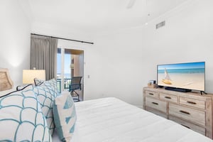Sink into the Primary bedroom where soothing beach tones invite total relaxation.