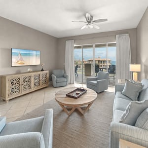 Unwind in your coastal living room where soft seating and ocean breezes through the balcony invite you to relax with breathtaking sea views just beyond your door.