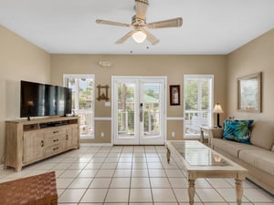 Spacious Living Room with Large Flat Screen TV