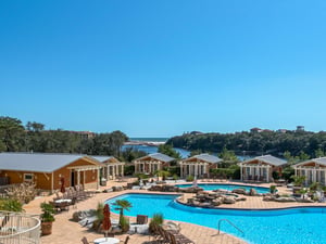 Picturesque view of the pool, lake and Gulf