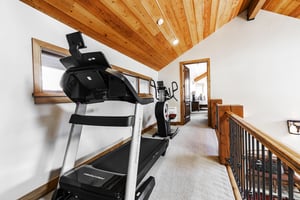 Treadmill and elliptical located on the upper level.