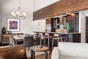 The dining area and open concept kitchen with island.