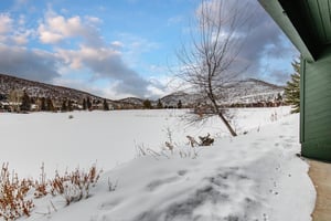 The lake covered with winter snow and mountain views.