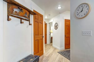 Step into your welcoming entrance, where warm wood accents and thoughtful rustic touches set the tone for your mountain getaway the moment you arrive.