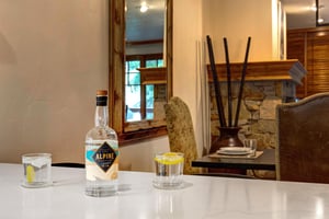 Unwind with your favorite beverage at the sleek bar counter, where thoughtful décor and ambient touches create a refined space for relaxation.