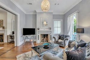 Each floor has a separate living space, open to a formal dining room, with access to a balcony overlooking Broughton Street.