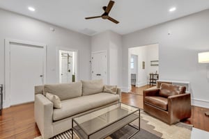 Updated living room with all new furniture and wall mounted flat screen TV