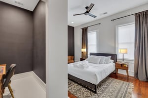 Perfect size bedroom with queen bed, flat screen TV, and large closet