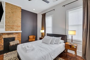 Perfect size bedroom with queen bed, flat screen TV, and large closet
