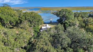 Enjoy beautiful sunsets and views over Half Moon Creek from your backyard