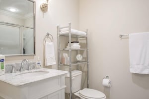 The full bath is crisp and spacious.