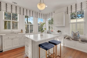 Heading into the kitchen, guests will find another room filled with windows and natural light.