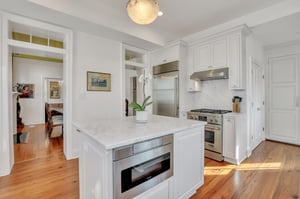Marble countertops are carried throughout the kitchen, along with topoftheline stainless steel appliances.