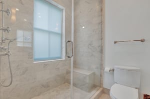 The ensuite offers a marble walkin shower, ensuring a spalike experience.