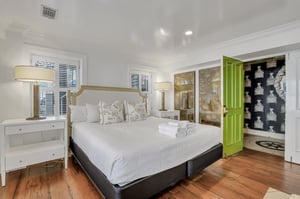 Enter into the studio and find a plush king bed.