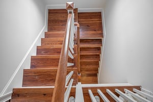 Staircases are located at the front and back of the home will take you to all four floors of this historic mansion.