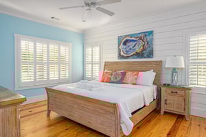 On the same level as the kitchen and living room, guests will find the primary suite with King bed.