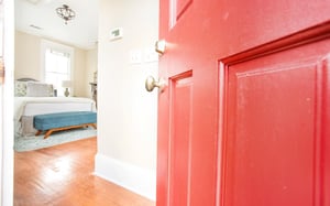 Enter at the bright red door.