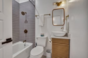 31077