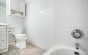 The first bath has a tubshower combination.