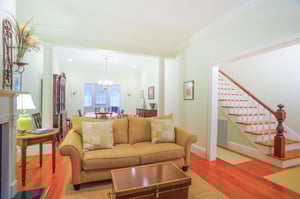 A comfortable couch welcomes you to the living room.