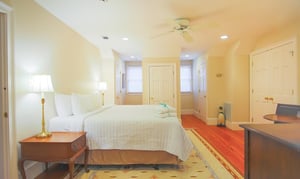 A king bed and seating area are featured here.