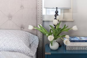 Modern tufted headboard with queen size bed in the primary bedroom.
