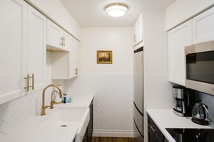 Brass finishes tie this space together and accent the light fixtures throughout.