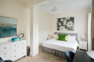 At the end of the hall, you will find the first bedroom.