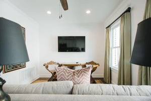 A smart television is mounted center of the room for convenience.