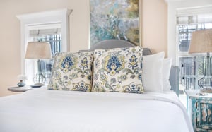 The bedroom features a Queen size bed.