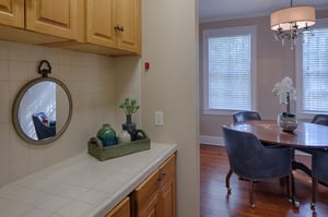 The butlers pantry leads to the dining room.