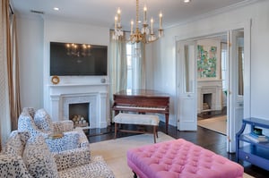 The decorative fireplace, and grand piano truly bring this space to life.