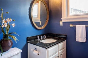 A half bath is hidden behind the kitchen.