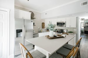 The large kitchen island is ideal for prepping meals, and can seat all six of your guests.