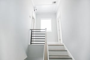 Atop of the stairs you will find split bedrooms.