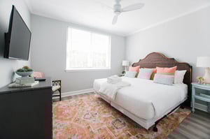 The primary bedroom offers a kingsize bed and charming decor.