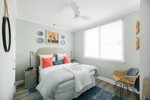 At the front of the apartment, you will find the second bedroom.