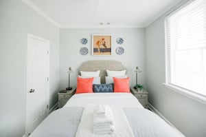 Plush throw pillows accent the space with vibrant colors.