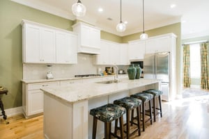Offering granite countertops, a gas range, wall oven, and french door fridge, this kitchen has it all.