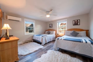 Two queen beds in 2nd bedroom, ceiling fan, corner room with 2 windows and its own bathroom