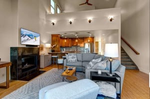 Openconcept living room offers a gas fireplace, seamlessly connected to the kitchen for easy entertaining and relaxation.