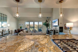 Modern, fully equipped kitchen with luxury granite countertops, updated appliances, and ample cabinet space.