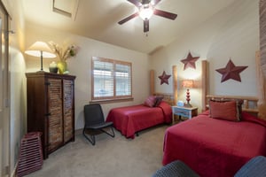 Guest bedroom with two twin beds.