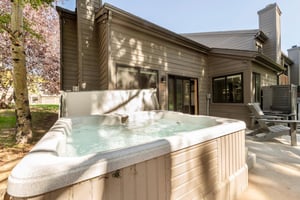 Hot tub is located on the adjacent patio for cozy nights under the stars.
