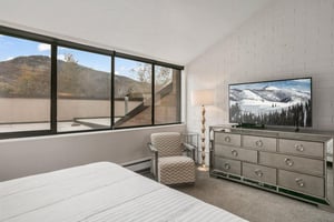 Modern bedroom retreat with king and television