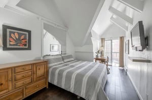 Restful nights await in the bright, airy master bedroom at Lodge at Mountain Village 303 — your skiinskiout retreat at Park City Resort.