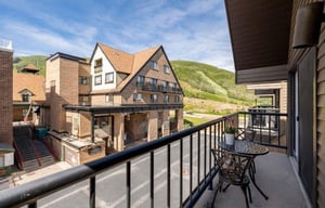 Take in the resort village vibes from the private balcony at Lodge at Mountain Village 303 — your skiinskiout home base at Park City Resort.