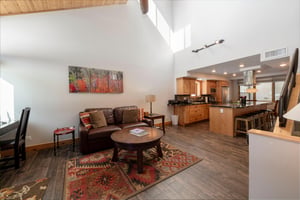 Soaring ceilings, warm wood accents, and a comfortable open layout make the living space at Park Avenue 235 a stylish and welcoming home base for your Park City stay.