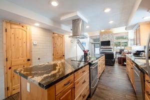 Modern appliances, granite counters, and an open flow to the living area make the kitchen at Park Avenue 235 a true centerpiece of this beautifully remodeled Park City condo.